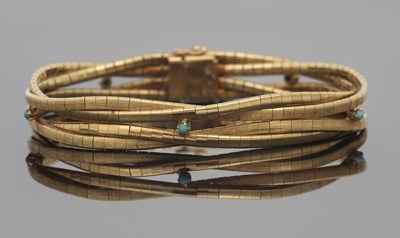 Lot 294 - An 18ct bracelet, the four strand plaited...