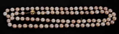 Lot 118 - A cultured pearl necklace, the pinky-peach...