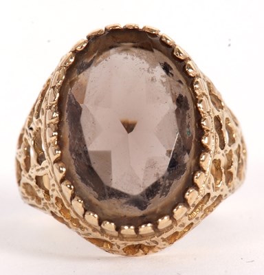 Lot 51 - A 9ct smokey quartz ring, the oval smokey...