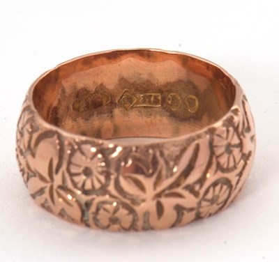 Lot 156 - A 9ct wedding band, the 8mm wide band with...