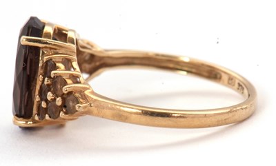 Lot 56 - A 9ct smokey quartz and citrine cluster ring,...