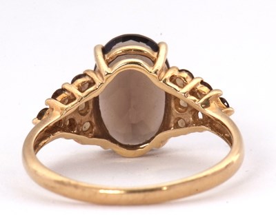 Lot 56 - A 9ct smokey quartz and citrine cluster ring,...