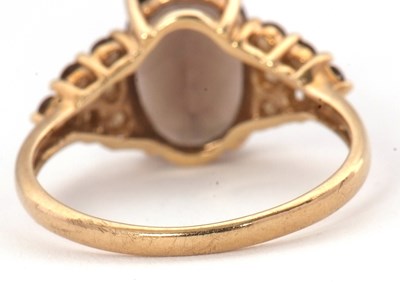 Lot 56 - A 9ct smokey quartz and citrine cluster ring,...