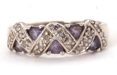 Lot 61 - A 9ct diamond and tanzanite ring, set with...