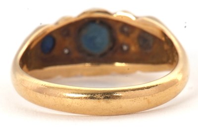Lot 64 - An 18ct sapphire and diamond ring, with a...