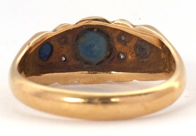 Lot 64 - An 18ct sapphire and diamond ring, with a...