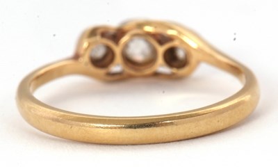 Lot 63 - A three stone diamond ring, set with three...