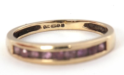 Lot 58 - A 9ct gemset ring, with channel set small...