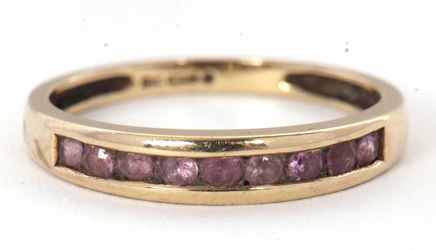 Lot 58 - A 9ct gemset ring, with channel set small...