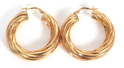 Lot 155 - A pair of 9ct earhoops, with twisted effect,...