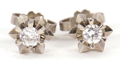 Lot 88 - A pair of 18ct diamond earstuds, the round...