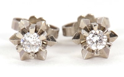 Lot 88 - A pair of 18ct diamond earstuds, the round...