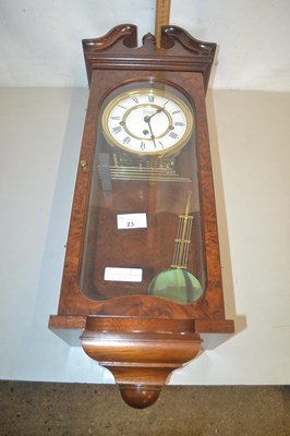 Lot 23 - A modern wall clock in mahogany case