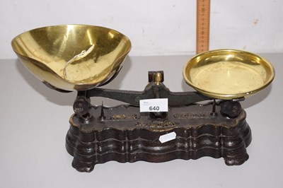 Lot 640 - A pair of brass and iron weighing scales