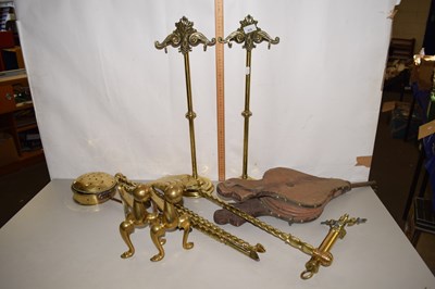 Lot 670 - A pair of bellows together with a brass fire...
