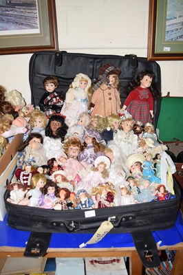 Lot 673 - A large suitcase full of various collectors dolls