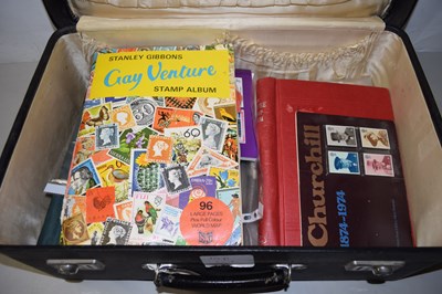 Lot 679 - Small suitcase containing various stamp albums,...