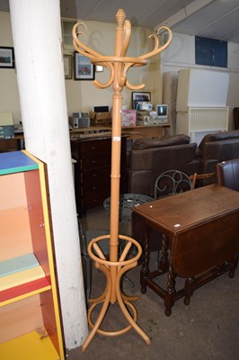 Lot 767 - A light wood coat and hat stand