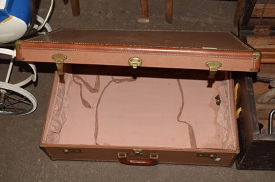 Lot 775 - A vintage brown leather suitcase