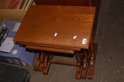 Lot 800 - A set of three varnished nesting tables
