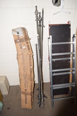 Lot 834 - A collection of various curtain poles with...