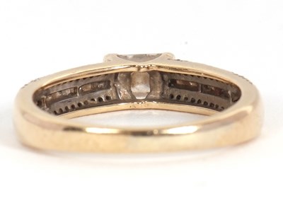 Lot 67 - A 9ct diamond ring, set with a central...