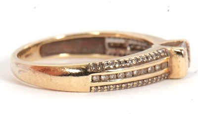 Lot 67 - A 9ct diamond ring, set with a central...