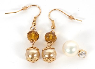 Lot 200 - A faux pearl and CZ pendant stamped 14K, 2.6g,...