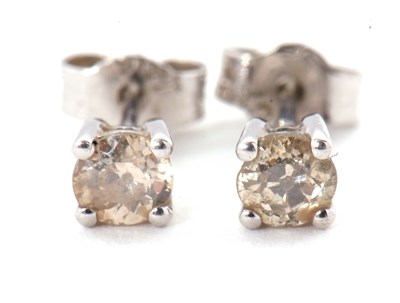 Lot 124 - A pair of round brilliant cut diamond earstuds,...