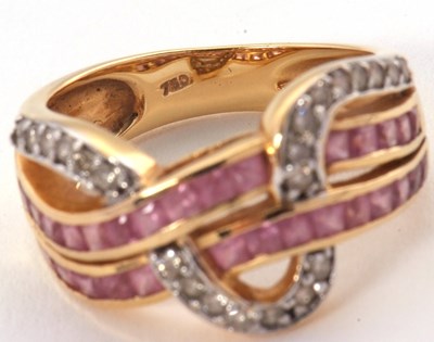 Lot 38 - An 18ct diamond and pink stone ring, set with...