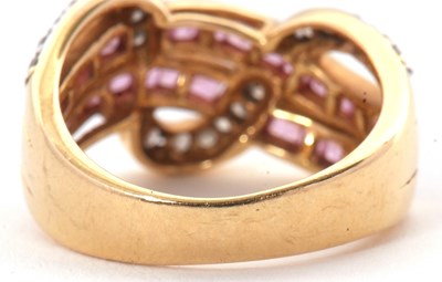 Lot 38 - An 18ct diamond and pink stone ring, set with...