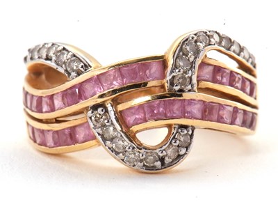 Lot 38 - An 18ct diamond and pink stone ring, set with...