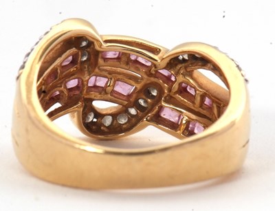Lot 38 - An 18ct diamond and pink stone ring, set with...
