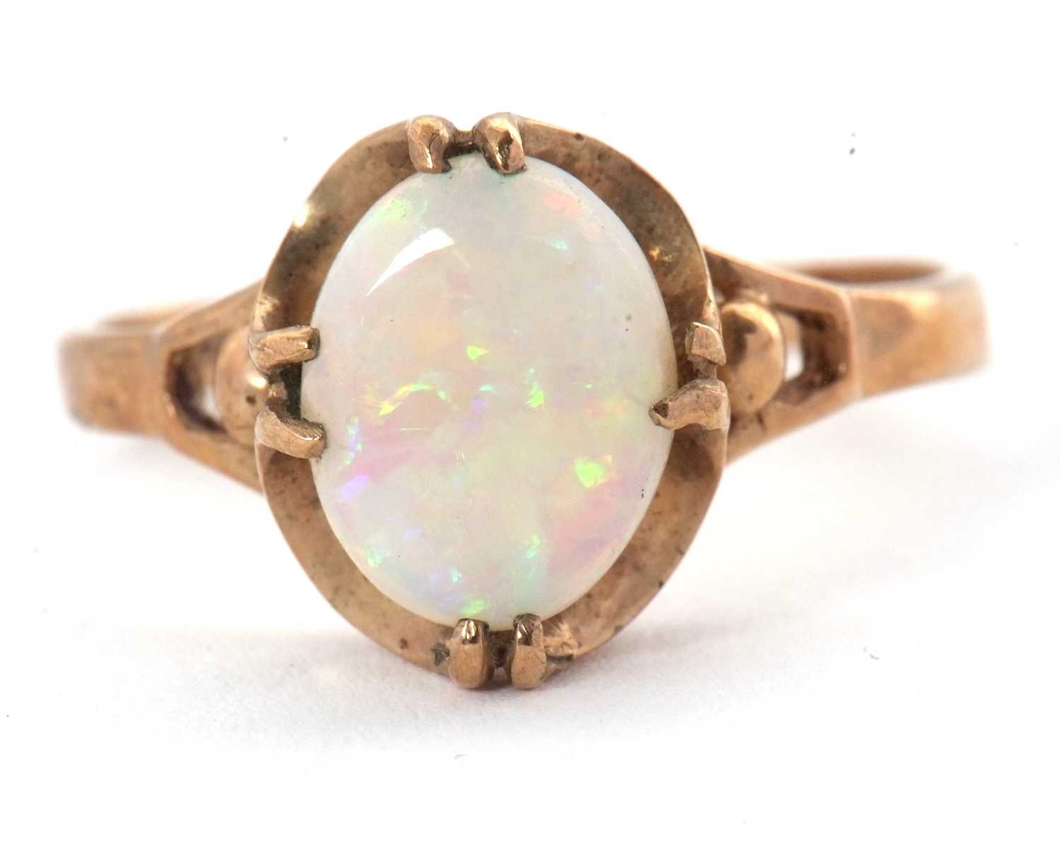 Lot 39 - A 9ct opal ring, the oval opal cabochon, claw...