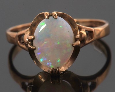 Lot 39 - A 9ct opal ring, the oval opal cabochon, claw...