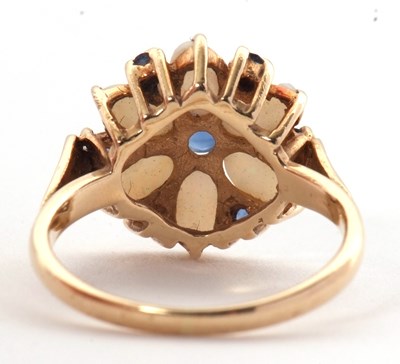 Lot 41 - A 14ct opal and sapphire ring, set with a...