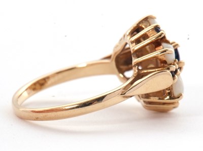 Lot 41 - A 14ct opal and sapphire ring, set with a...