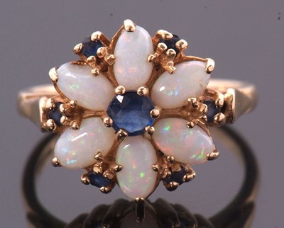Lot 41 - A 14ct opal and sapphire ring, set with a...