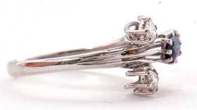 Lot 42 - A sapphire and diamond ring, set with an oval...