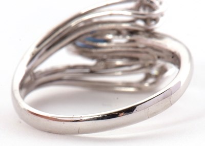 Lot 42 - A sapphire and diamond ring, set with an oval...