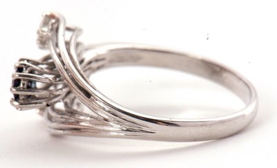 Lot 42 - A sapphire and diamond ring, set with an oval...