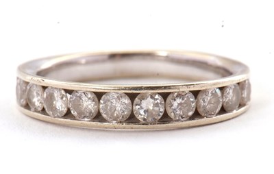 Lot 45 - A 9ct diamond ring, with channel set round...