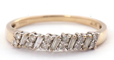 Lot 50 - A 9ct diamond ring, set with round brilliant...