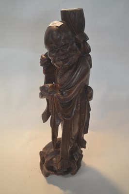 Lot 226 - A Chinese carved hardwood figure of an...