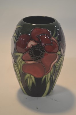Lot 256 - A small Moorcroft vase with tubelined floral...