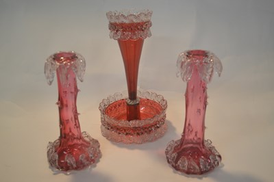 Lot 265 - Group of three cranberry glass vases including...