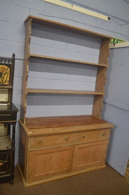 Lot 405 - A 19th Century pine dresser with open two...