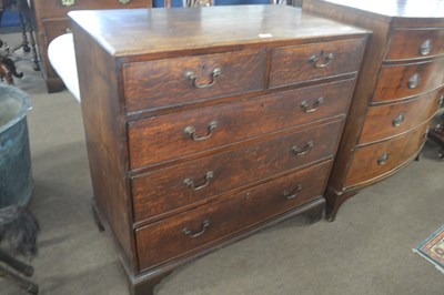 Lot 461 - A George III oak chest of drawers with two...