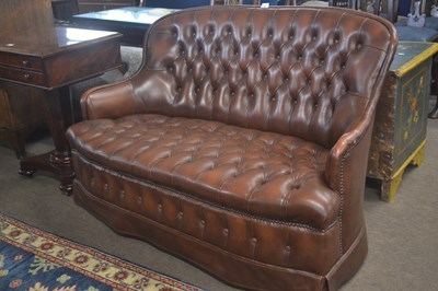 Lot 466 - A small buttoned leather two seater sofa,...
