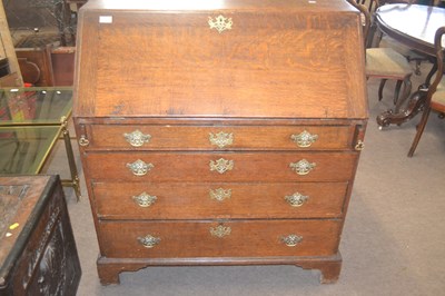 Lot 472 - A George III oak bureau of typical form, the...